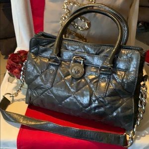 Michael Kors metallic charcoal handbag.